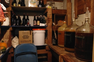 The cellar!  Three batches are against the right wall still fermenting, and dry storage and bottles of finished beer against the back wall.  This area also is filled with pickles and jams, and buckets of grains and beans.  A room all homesteads and hobbit holes should have. 